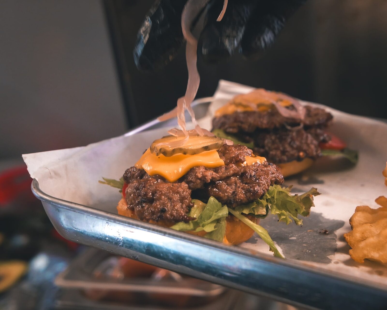 Cheese pull close-up on a smash burger